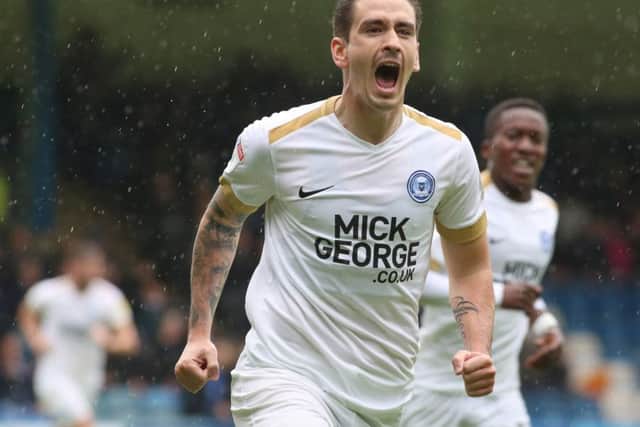 Jamie Walker of Posh celebrates the opening goal of the game at Gillingham. Photo: Joe Dent/theposh.com.