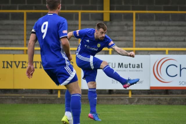 Josh Moreman shoots Peterborough Sports ahead at Boston United. Photo: James Richardson.