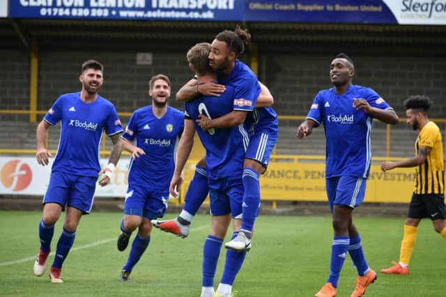 Josh McCammon (right) celebrates his goal for Peterborough Sports at Boston United. Photo: James Richardson.