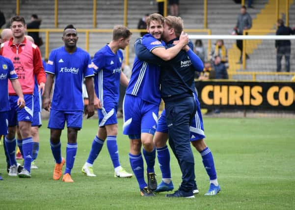 Peterborough Sports manager Jimmy Dean (right) celebrates with his players after the shock FA Cup win at Boston United. Photo: James Richardson.