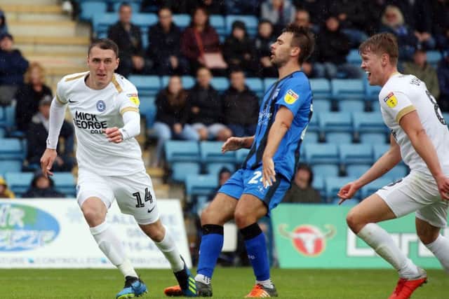 Callum Cooke (left) has just scored for Posh at Gillingham. Photo: Joe Dent/theposh.com.