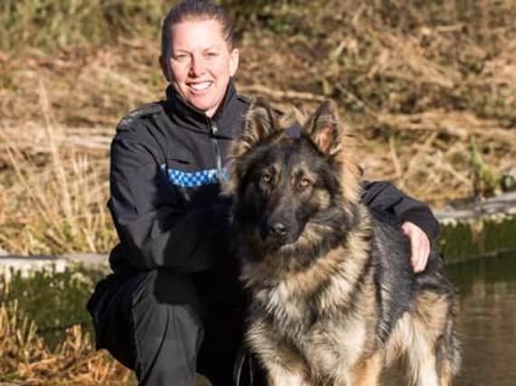 Police dog Harley with his handler PC Lindsey Cox