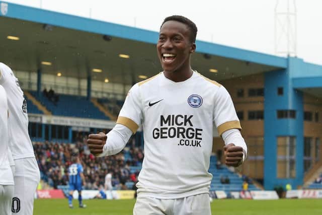 Siriki Dembele celebrates the Posh win at Gillingham.