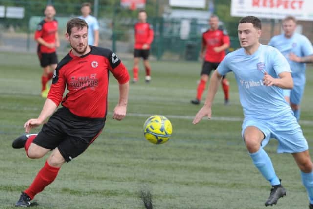 Netherton United (red) in action.