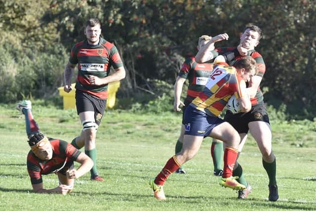 Borough's George Offer makes a run for it against Paviors. Picture: David Lowndes