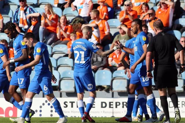 Posh players celebrate a goal for Rhys Bennett against Blackpool. Photo: Joe Dent/theposh.com.