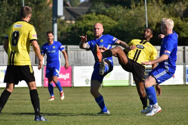 High kicking action in the game between Peterborough Sports and Sutton Coldfield. Photo: James Richardson.
