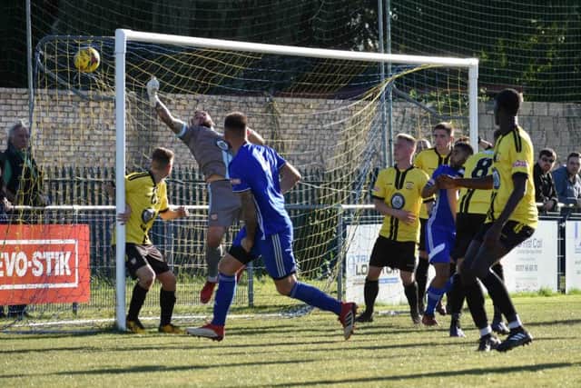 Paul Malone scores the winning goal for Peterborough Sports against Sutton Coldfield. Photo: James Richardson.
