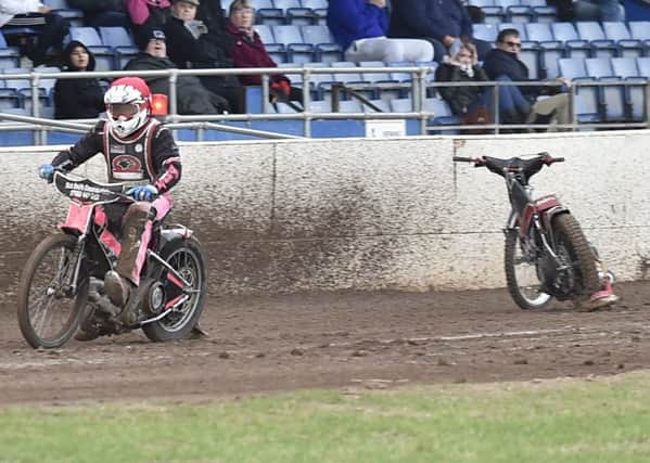 A Lakeside rider has fallen off in heat two of the meeting against the Peterborough Panthers. Photo: David Lowndes.