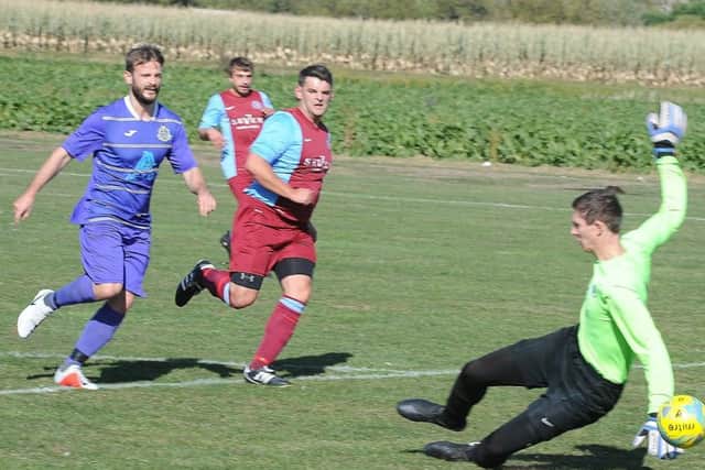 Action from Peterborough NECI (blue) v Thorpe Wood Rangers. Photo: David Lowndes.