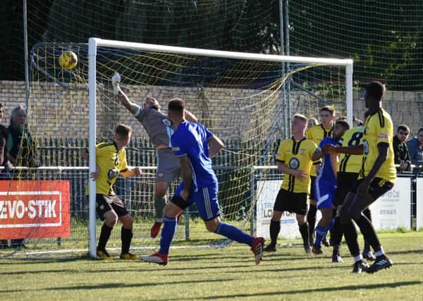Action from Peterborough Sports (blue) win over Sutton Coldfield in the FA Trophy last weekend. Photo: James Richardson.