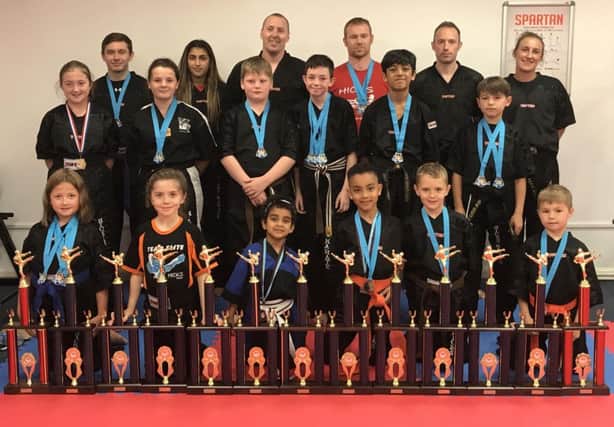 Pictured are some of successful Hicks Karate School students.  From the left are, back, Aaron Dickerson, Elise Ward, David Cairns, Darren Sindall, Martin Hobbs, Sarah Ward, middle, Lucy Hicks, Casey Stone,  Warren Bothamley, Aaron Leonard, Shiv Panchal, Denas Jankauskas, front, Sophie Hicks, Sophie Doyle, Tiana Celaire, Joell Celaire, Oliver Profitt and Joshua Leonard.