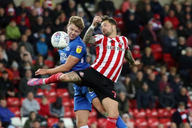 Posh midfielder Mark O'Hara challenges Sunderland's Chris Maguire for the ball.  Photo: Joe Dent/theposh.com.