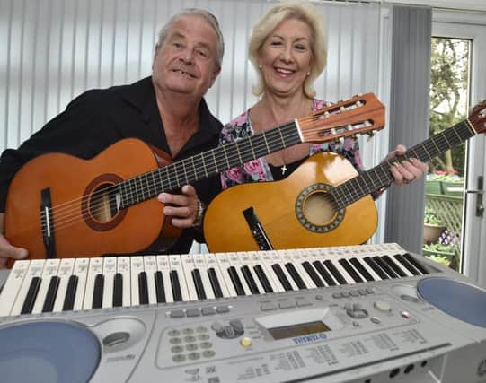 John and Rosie Sandall with musical instruments for sale at their next Chernobyl event EMN-180110-223904009