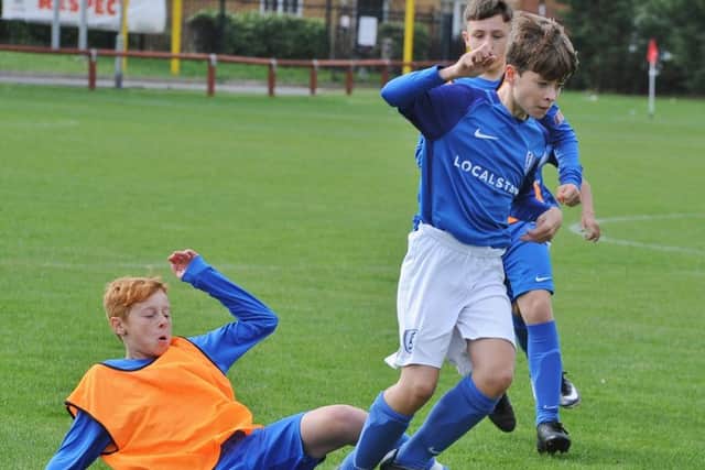 Action from the game between ICA Under 14s and Feeder Soccer which finished 5-5.
