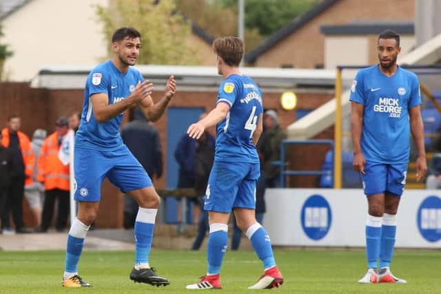Ryan Tafazolli of Peterborough United shows his frustration to team-mates after conceding their fourth goal of the game. Photo: Joe Dent/theposh.com
