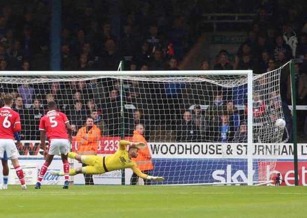 Aaron Chapman of Peterborough United dives in vain as Brad Potts of Barnsley (not in picture) fires in his sides second goal of the game. Photo: Joe Dent/theposh.com