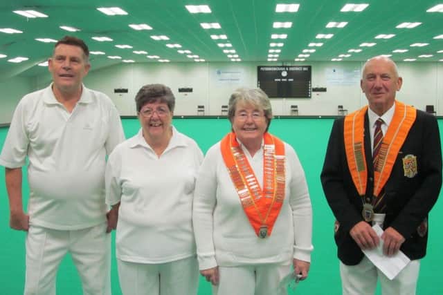 Leading officials of the Northants Bowling Federation and Northants Womens Bowling Federation line-up before Sundays annual men against ladies indoor match at Peterborough & District.  Left to right are Dick Noble (NBF deputy president), Liz Barr (NWBF secretary), Jessica Phillips (NWBF president) and Tony Mace (NBF president).