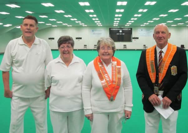 Leading officials of the Northants Bowling Federation and Northants Womens Bowling Federation line-up before Sundays annual men against ladies indoor match at Peterborough & District.  Left to right are Dick Noble (NBF deputy president), Liz Barr (NWBF secretary), Jessica Phillips (NWBF president) and Tony Mace (NBF president).