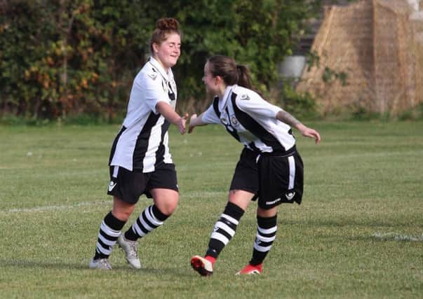 Alexa Hunter is congratulated after scoring one of her five goals against Crick Athletic.