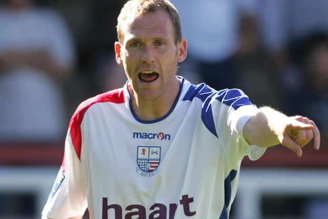 Brighton coach Simon Rusk in his playing days.