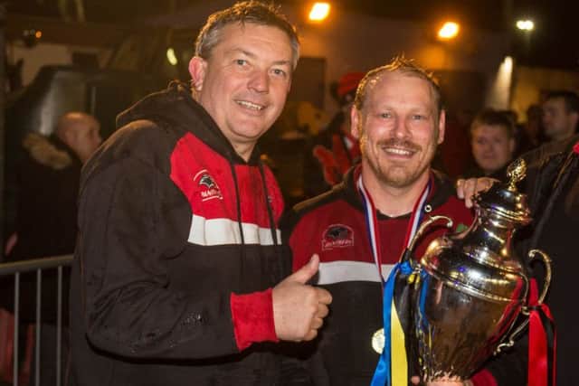 Panthers owner Ged Rathbone (left) and team manager Carl Johnson are walking away.