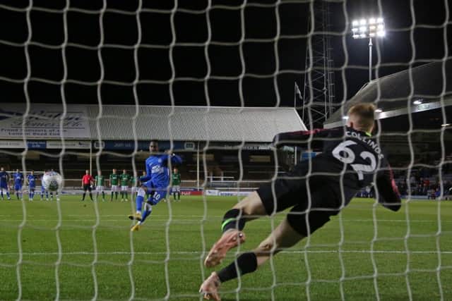 Siriki Dembele scores from the spot for Posh against Brighton during a penalty shootout.  Photo: Joe Dent/theposh.com.