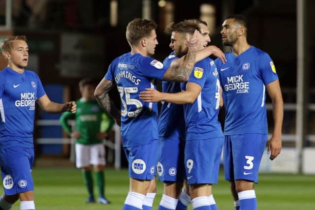 Posh players celebrate Matt Godden's goal against Brighton. Photo: Joe Dent/theposh.com.