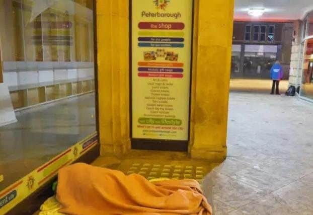 A rough sleeper in St Peter's Arcade