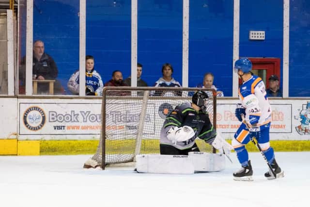 Corey McEwen scores the deciding penalty shot.