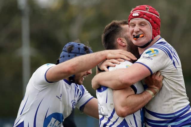 Ben Young gets a hug after scoring the winning try. Picture: Mick Sutterby