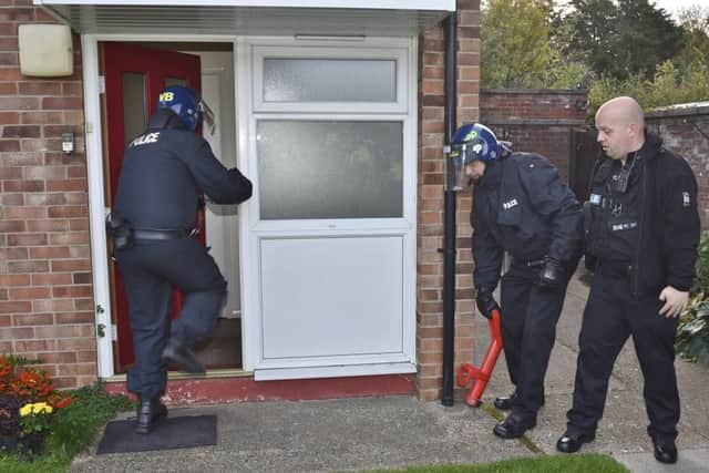 Police drugs raid at Mellows Close. EMN-180810-125854009