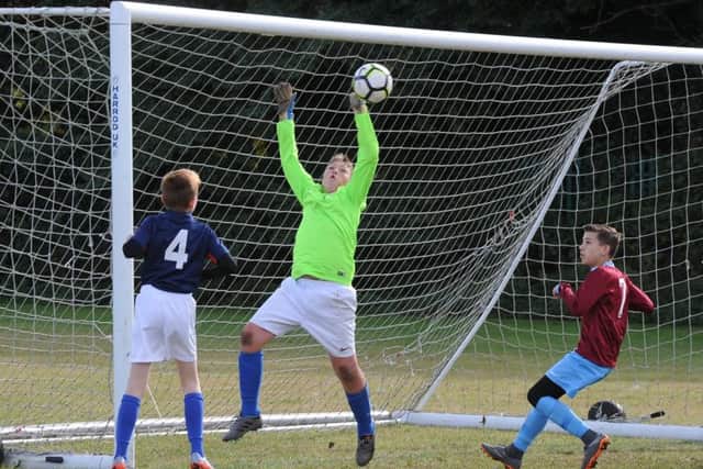 Action from the Feeder Under 13s v Deeping Rangers match.