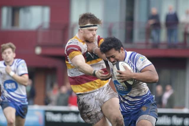 Lions centre Suva Ma'asi hands off a Fylde opponent. Picture: Mick Sutterby