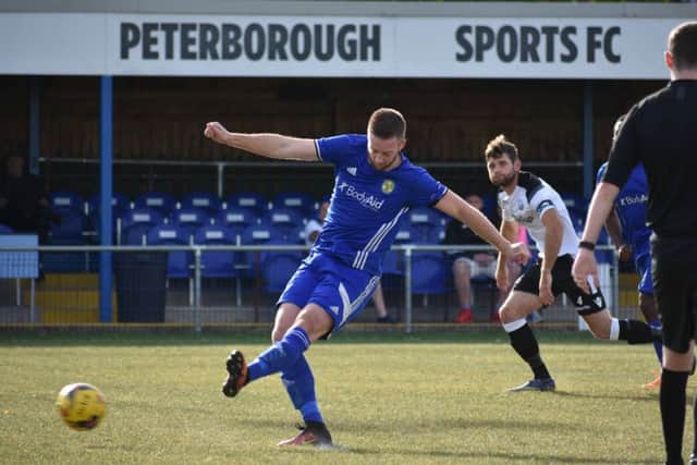 Jake Newman opens the scoring for Peterborough Sports against Cambridge City from the penalty spot. Photo: James Richardson.