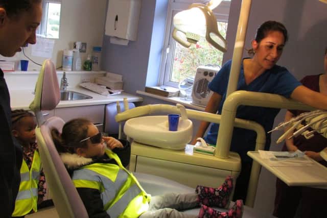 Nursery children visit local dentist and practice teeth brushing to promote oral health