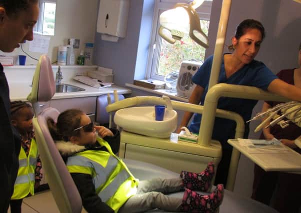 Nursery children visit local dentist and practice teeth brushing to promote oral health