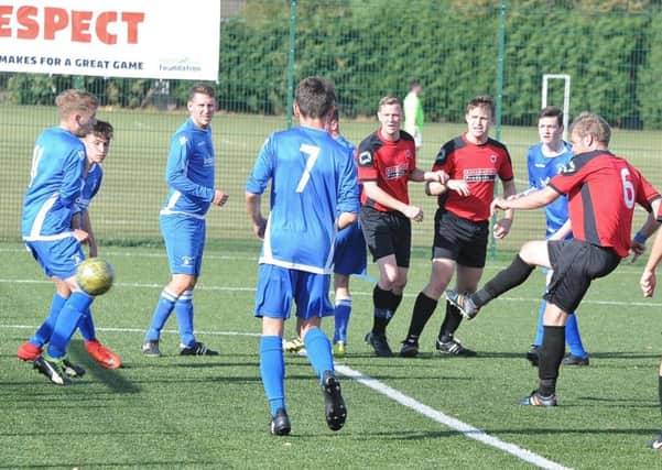 Netherton United Reserves (red) score against Warboys. Photo: David Lowndes.