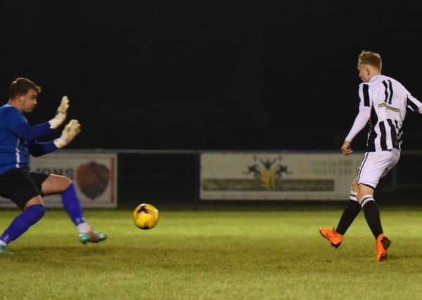 Lukas Gereltauskas of Peterborough Northern Star scores to make it 2-0 against Sleaford Town. Photo: Chantelle McDonald. @cmcdphotos