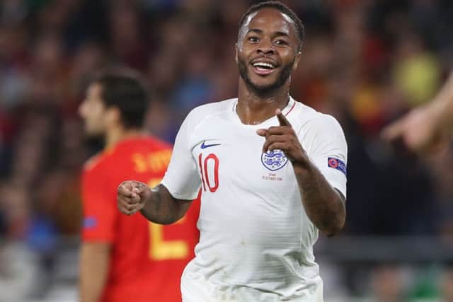 Raheem Sterlin celebrates a goal for England in Spain.