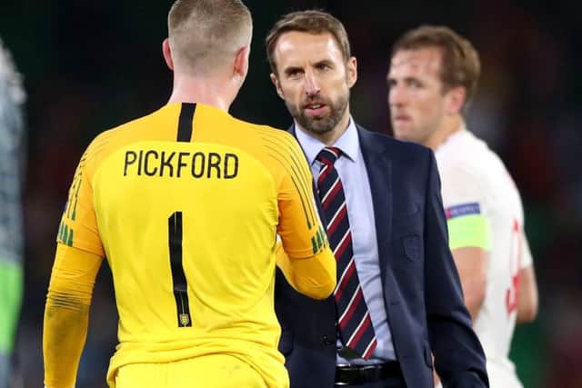Gareth Southgate congrulates Jordan Pickford after England's win in Spain.