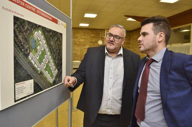 Paj Valley and Alex Munn from WSP consulting company displaying plans for the Gloucester Centre site at  the South Grove centre. EMN-181016-195845009