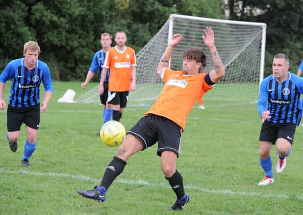 Action from Thorney's defeat at home to Moulton Harrox (blue) earlier this season.