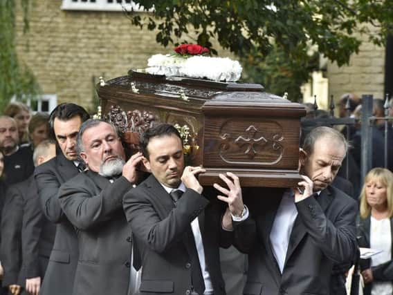 Pep's coffin being carried into the church