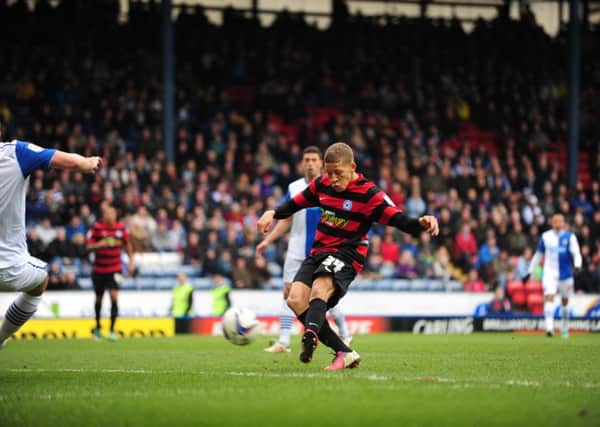 Dwight Gayle scores one of his three goals for Posh at Blackburn in 2013.