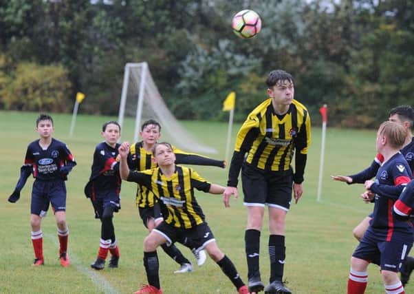 Action from the game between Werrington Under 13s and Holbeach Reds.