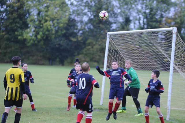 Action from the game between Werrington Under 13s and Holbeach Reds.