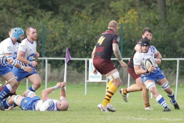 Lions skipper Conor Gracey (right) comes up against former Lions man Matt Dunn of Huddesrfield. Picture: Mick Sutterby