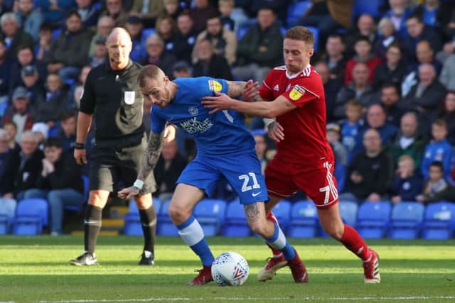 Marcus Maddison of Peterborough United in action with Jordan Clark of Accrington Stanley - Mandatory by-line: Joe Dent/JMP - 20/10/2018 - FOOTBALL - ABAX Stadium - Peterborough, England - Peterborough United v Accrington Stanley - Sky Bet League One
