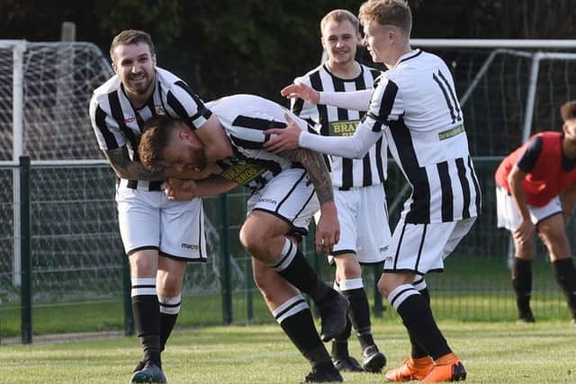 Josh Rosser (middle) of Peterborough Northern Star celebrates scoring against Harborough Town. Picture: Chantelle McDonald